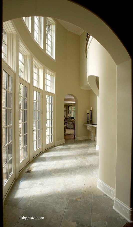 Large elegant hallway photo in Chicago with beige walls