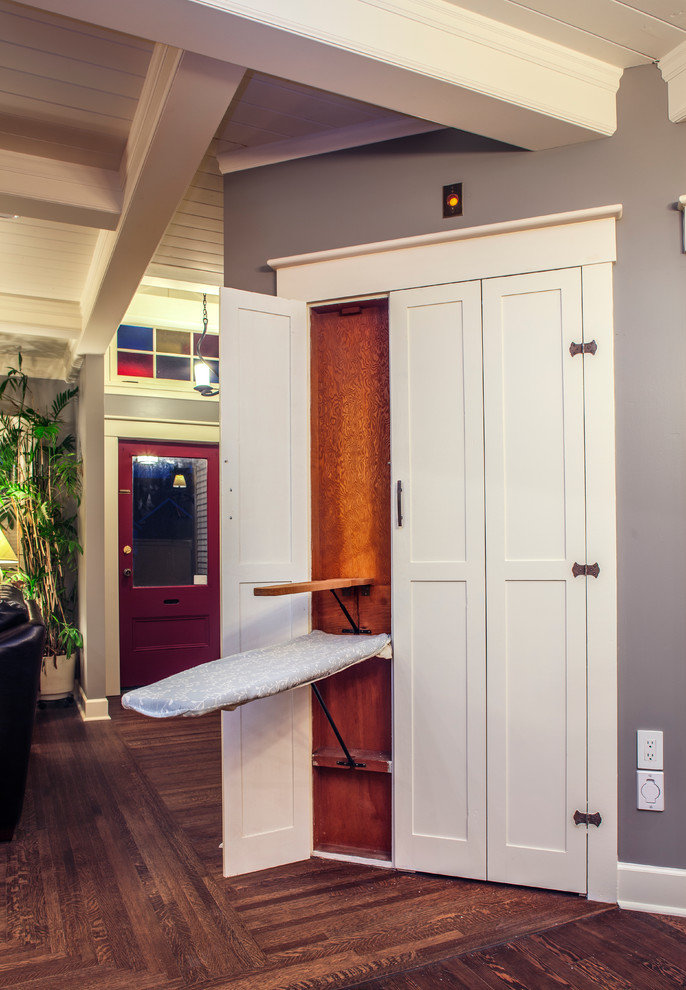 Hallway - mid-sized craftsman medium tone wood floor hallway idea in Vancouver with gray walls