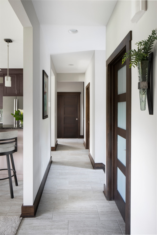 Example of a mid-sized arts and crafts laminate floor and gray floor hallway design in Milwaukee with gray walls