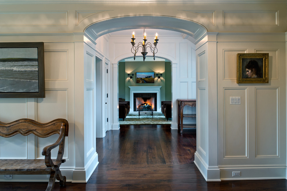 Hallway - large traditional dark wood floor hallway idea in New York with white walls