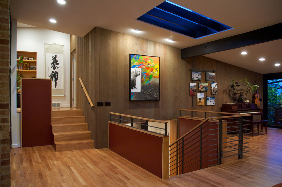 Inspiration for a contemporary medium tone wood floor hallway remodel in Seattle