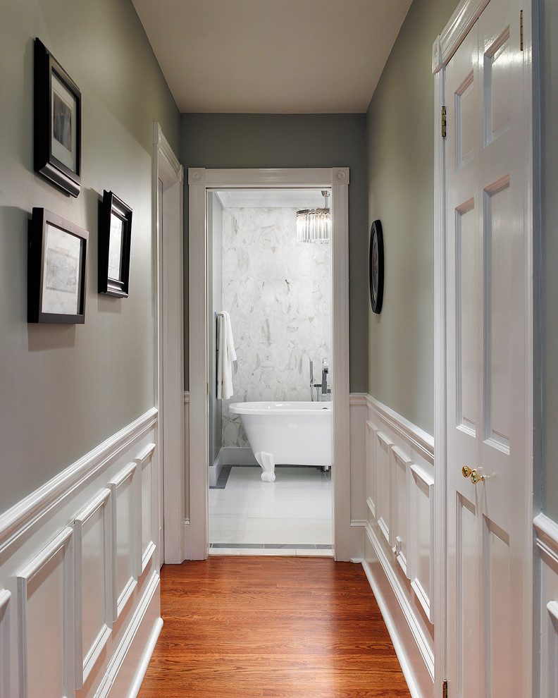 Inspiration for a transitional medium tone wood floor hallway remodel in Philadelphia with green walls