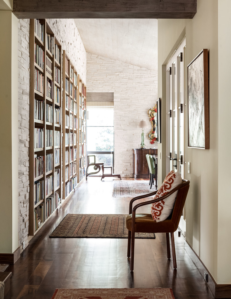 Inspiration for a mediterranean dark wood floor hallway remodel in Dallas with white walls