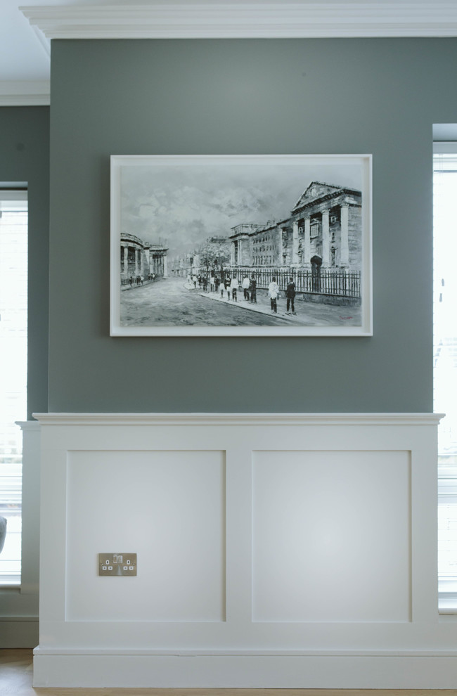 Minimalist medium tone wood floor hallway photo in Dublin with gray walls