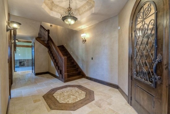 Inspiration for a huge transitional travertine floor hallway remodel in Phoenix with beige walls