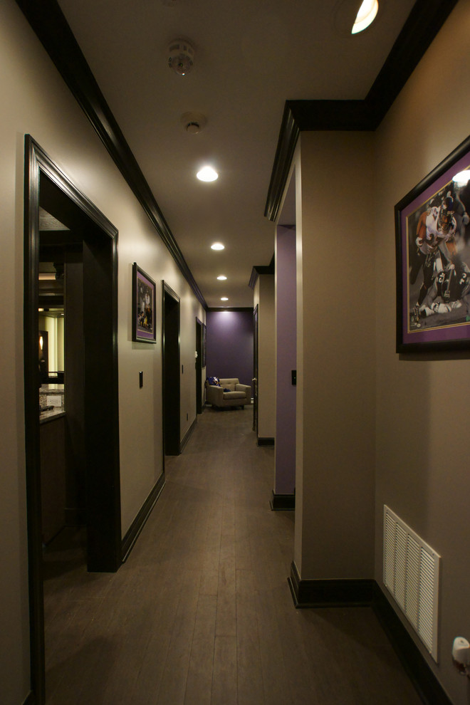 Hallway - large traditional medium tone wood floor hallway idea in Baltimore with beige walls