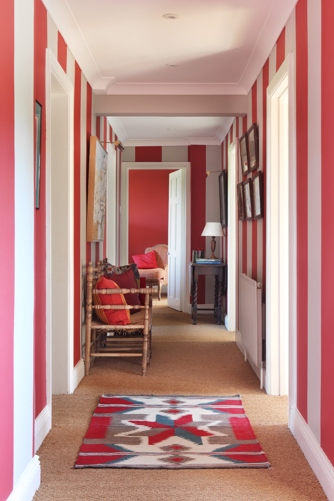 Cottage carpeted hallway photo in Dorset with multicolored walls