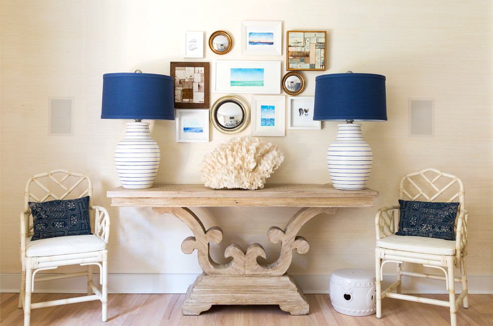 Hallway - large coastal light wood floor hallway idea in New York with beige walls