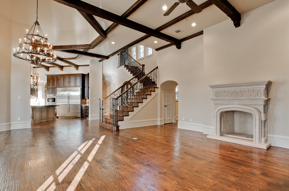 Inspiration for a large mediterranean medium tone wood floor and brown floor hallway remodel in Dallas with beige walls