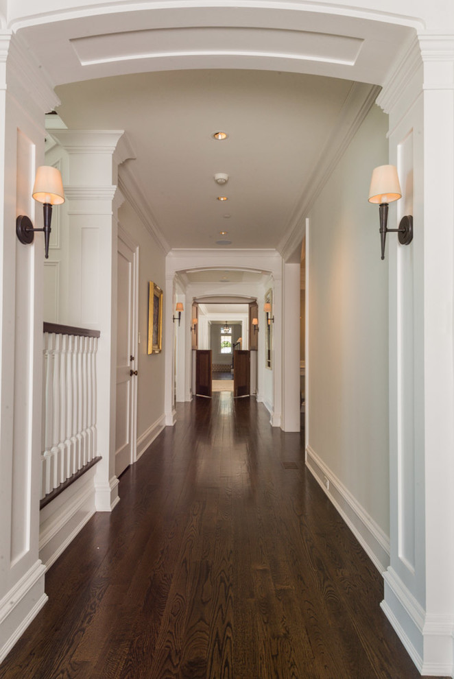 Hallway - large traditional dark wood floor hallway idea in Bridgeport with beige walls