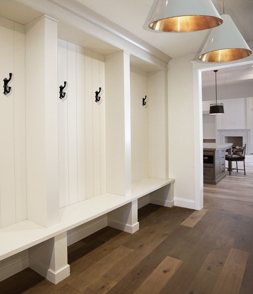 Hallway - transitional medium tone wood floor and brown floor hallway idea in Phoenix with white walls