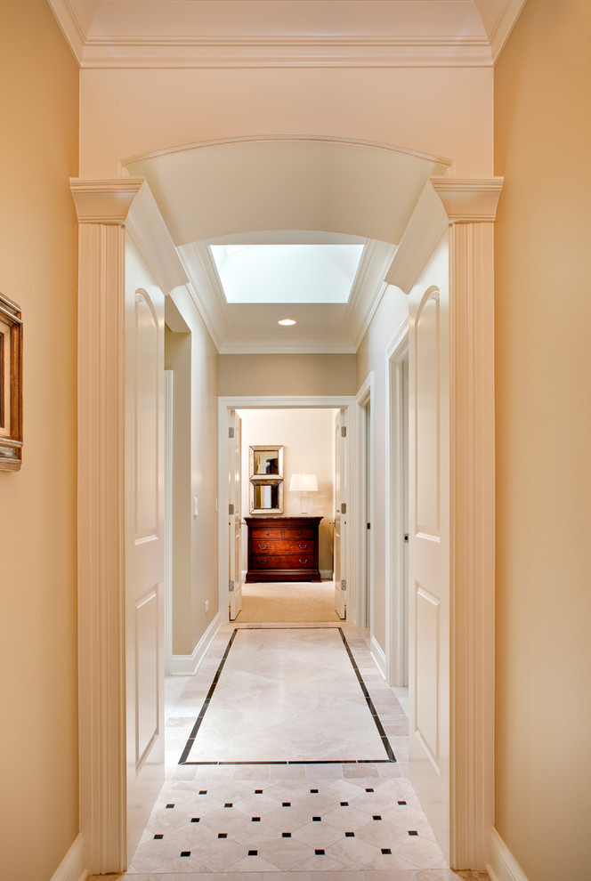 Example of a large classic ceramic tile hallway design in Chicago with beige walls