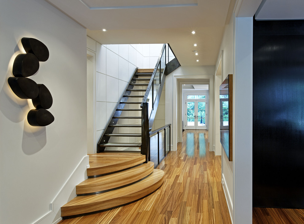 Inspiration for a contemporary hallway remodel in Toronto with white walls