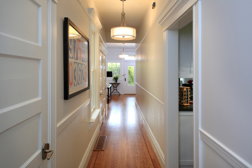 Example of a mid-sized transitional medium tone wood floor hallway design in San Francisco