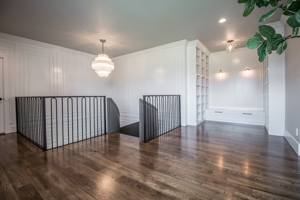 Example of a large transitional medium tone wood floor and brown floor hallway design in Other with gray walls