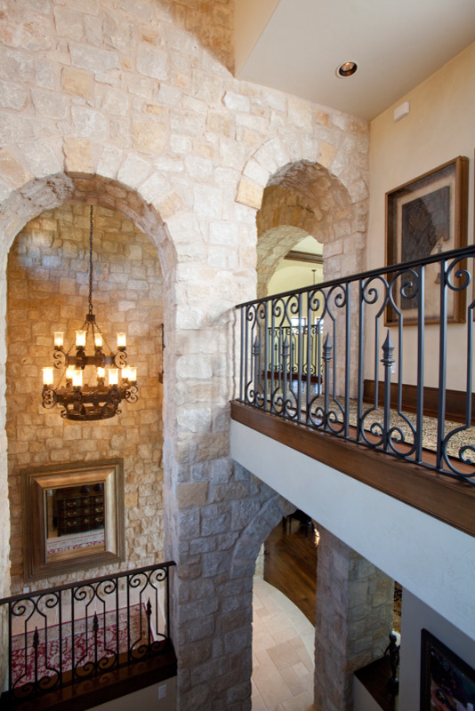 Inspiration for a large mediterranean hallway remodel in Austin with beige walls