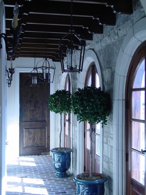 Example of a mid-sized classic brick floor and red floor hallway design in Boston with beige walls