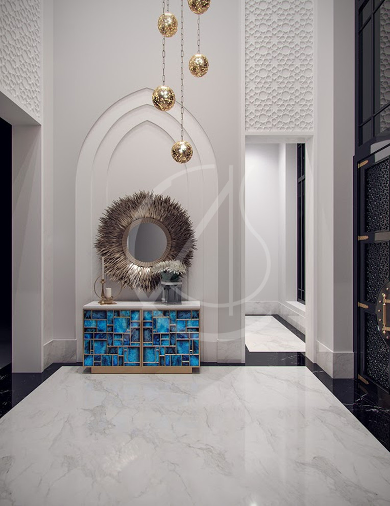 Immagine di un ingresso o corridoio minimal con pareti bianche, pavimento in marmo e pavimento bianco