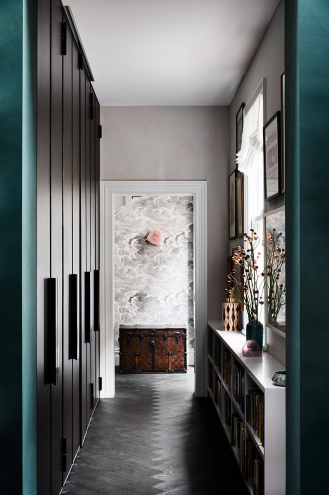 Eclectic dark wood floor and black floor hallway photo in Melbourne with gray walls
