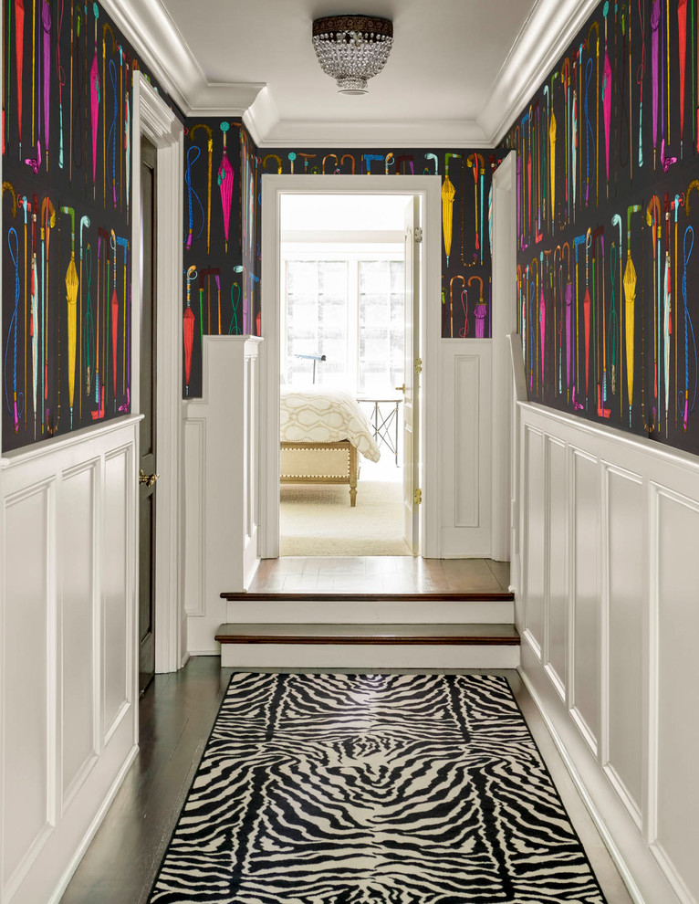 Inspiration for an eclectic dark wood floor and brown floor hallway remodel in Minneapolis with black walls