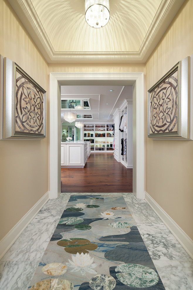 Inspiration for a small contemporary marble floor and multicolored floor hallway remodel in Other with beige walls