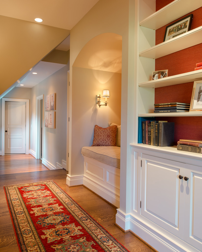 Hallway - large traditional medium tone wood floor hallway idea in Philadelphia with beige walls