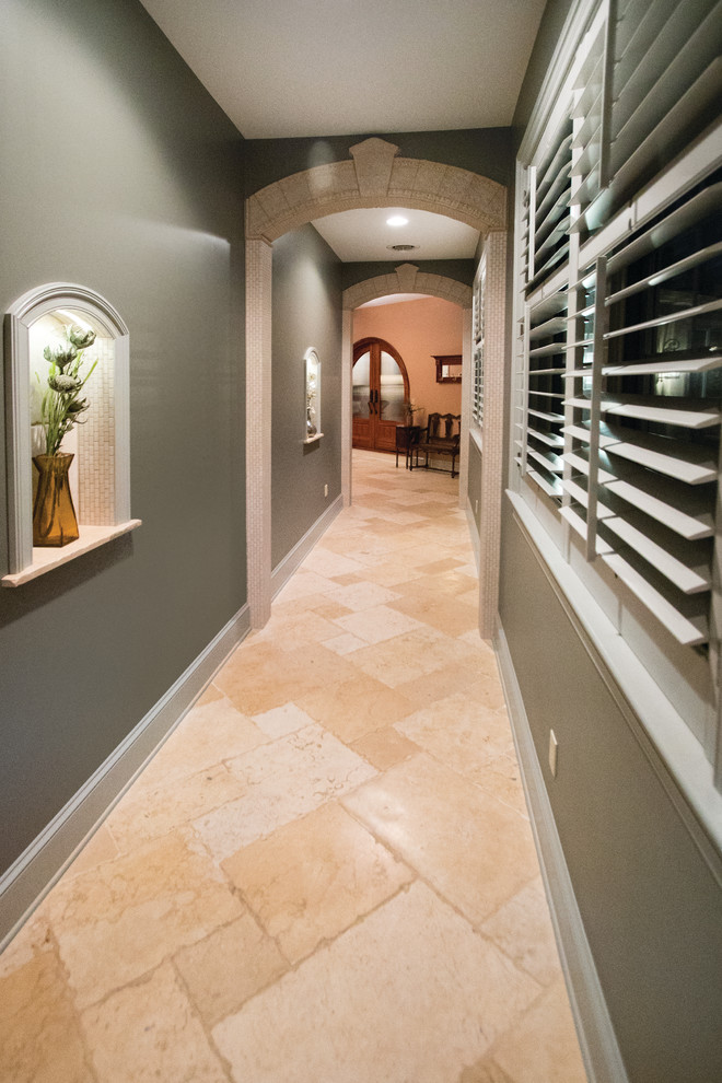Hallway - mid-sized traditional limestone floor and beige floor hallway idea in Philadelphia with green walls
