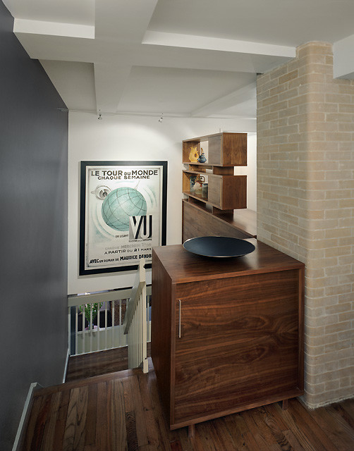 Inspiration for a small contemporary medium tone wood floor hallway remodel in New York with gray walls
