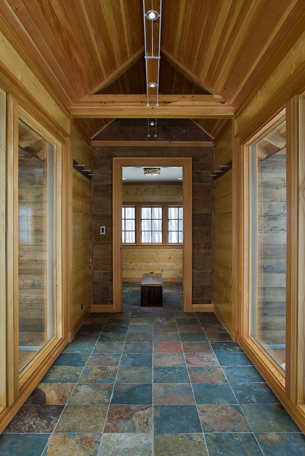 Hallway - large rustic slate floor and multicolored floor hallway idea in Other with multicolored walls