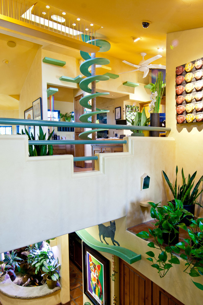 Hallway - eclectic hallway idea in Santa Barbara with beige walls