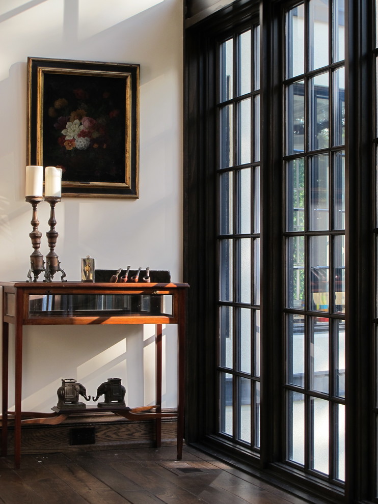 Example of a classic dark wood floor hallway design in Toronto with white walls