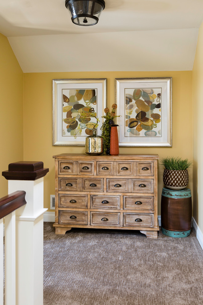 Hallway - traditional carpeted hallway idea in Other with yellow walls