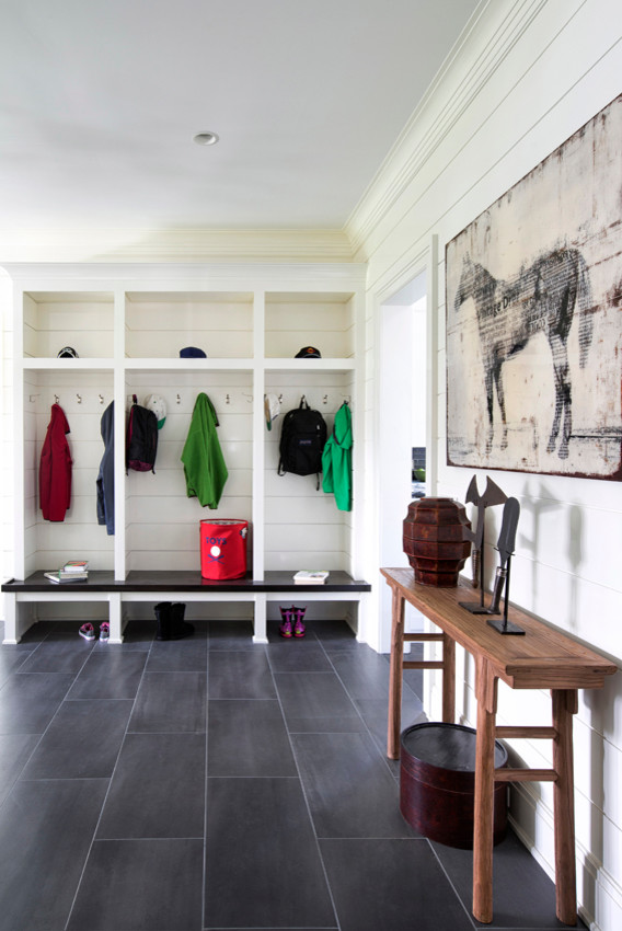 Example of a mid-sized transitional slate floor hallway design in New York with white walls