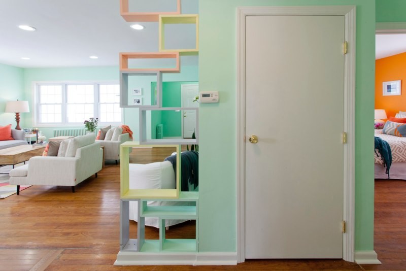 Inspiration for a mid-sized contemporary medium tone wood floor hallway remodel in New York with green walls