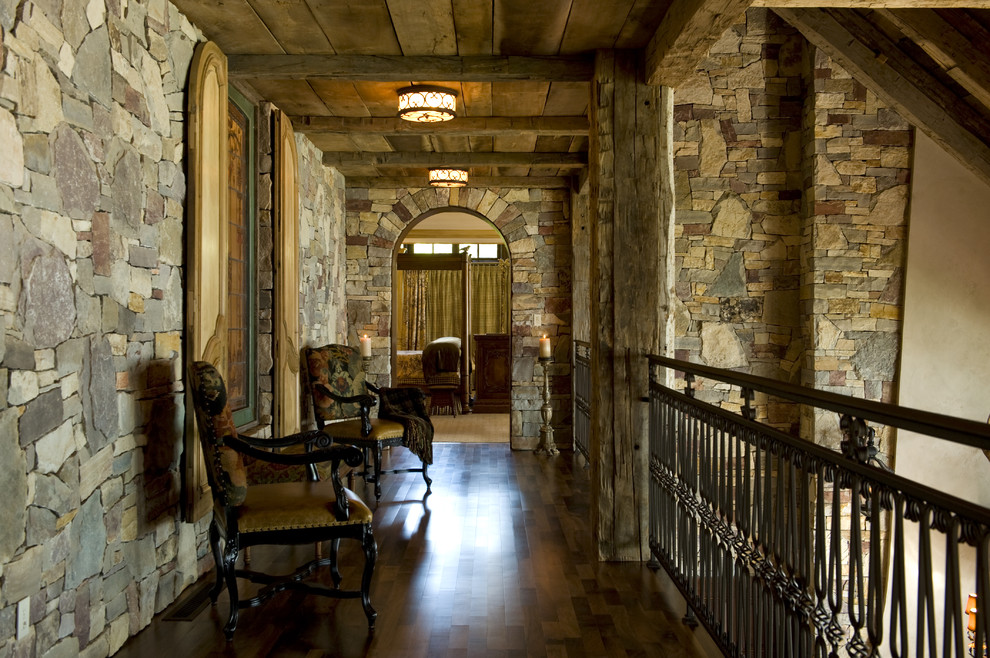 Inspiration for a rustic dark wood floor hallway remodel in Minneapolis