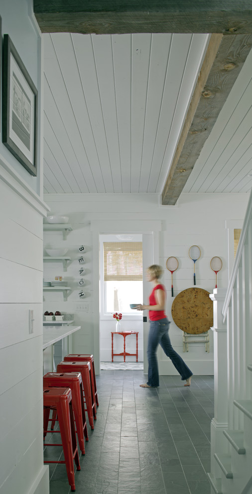 Inspiration for a coastal slate floor hallway remodel in Atlanta with white walls