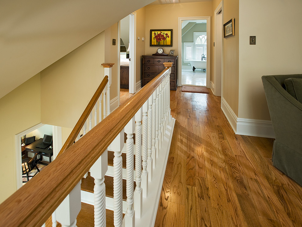 Hallway - mid-sized traditional medium tone wood floor hallway idea in Philadelphia with beige walls