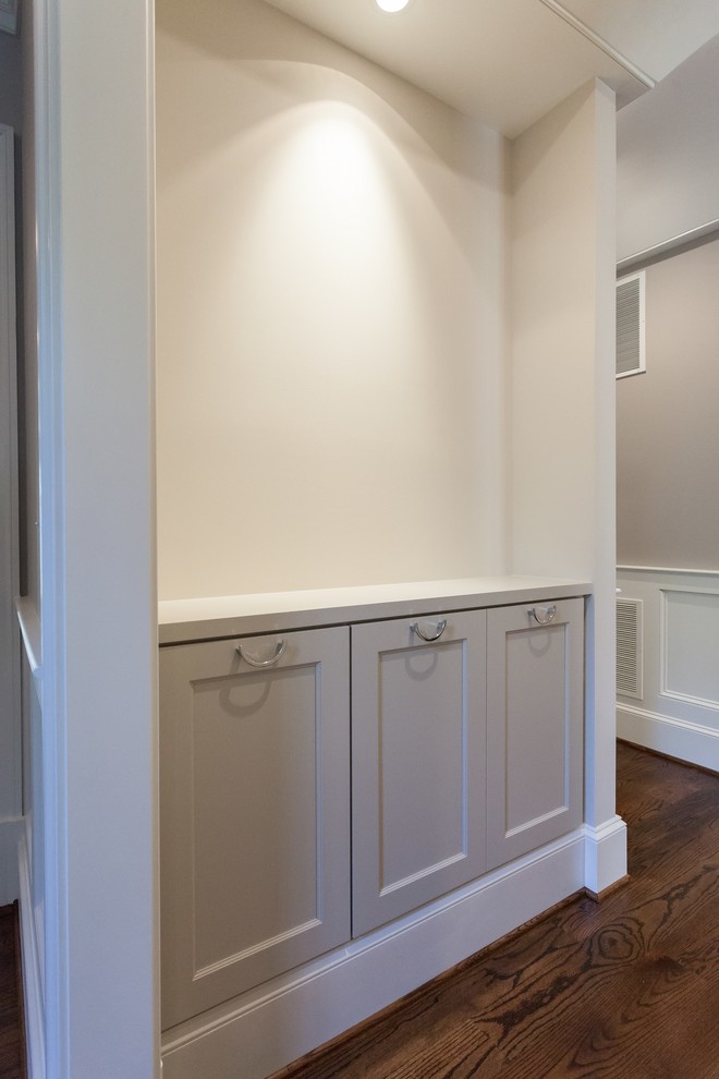 Inspiration for a timeless medium tone wood floor and brown floor hallway remodel in DC Metro with beige walls