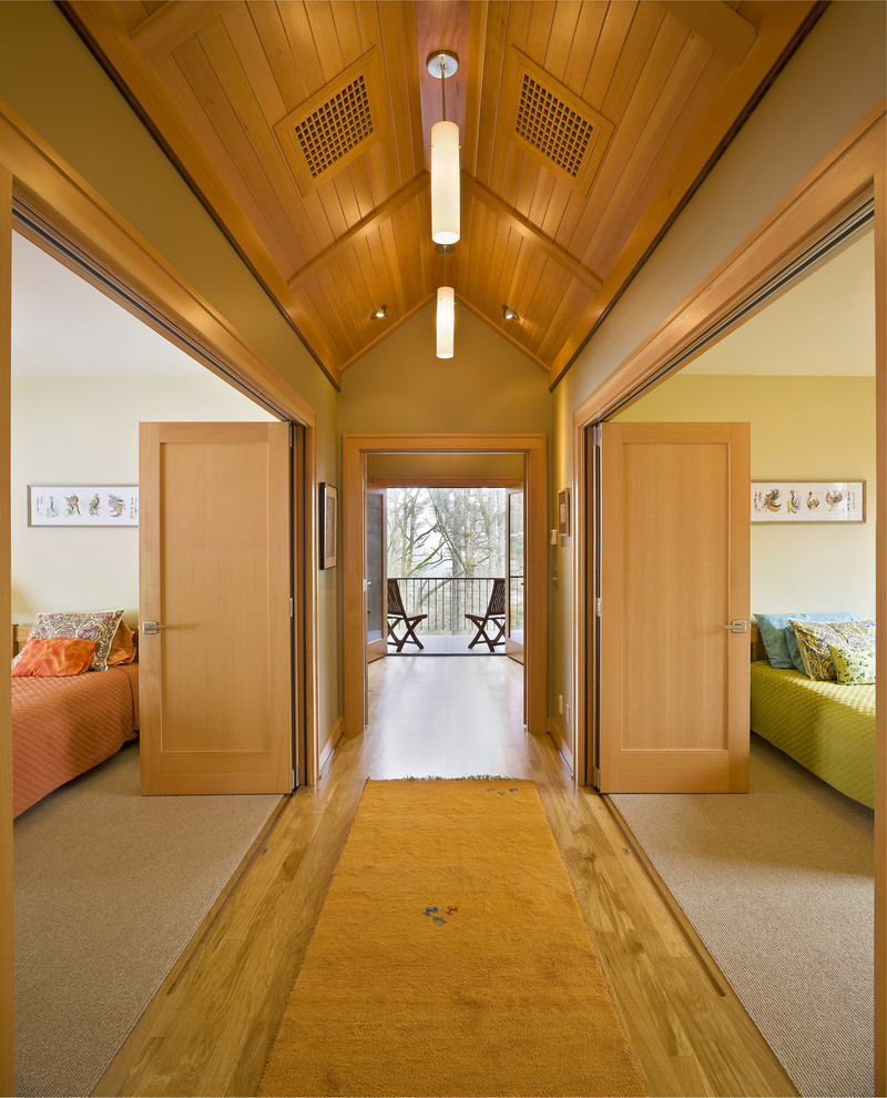 Example of a trendy medium tone wood floor hallway design in Portland