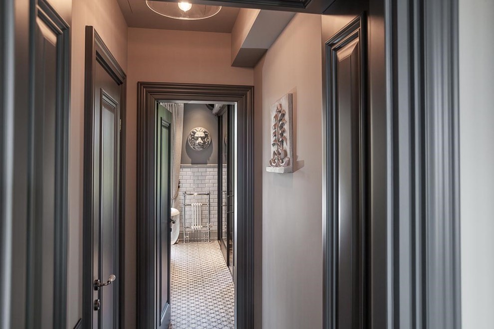 Inspiration for an industrial porcelain tile hallway remodel in London with gray walls