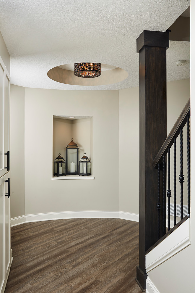 Inspiration for a mid-sized transitional vinyl floor and brown floor hallway remodel in Minneapolis with beige walls