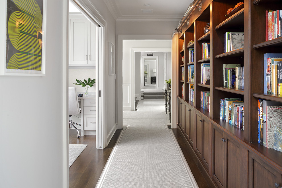 Inspiration for a timeless dark wood floor and brown floor hallway remodel in New York with gray walls