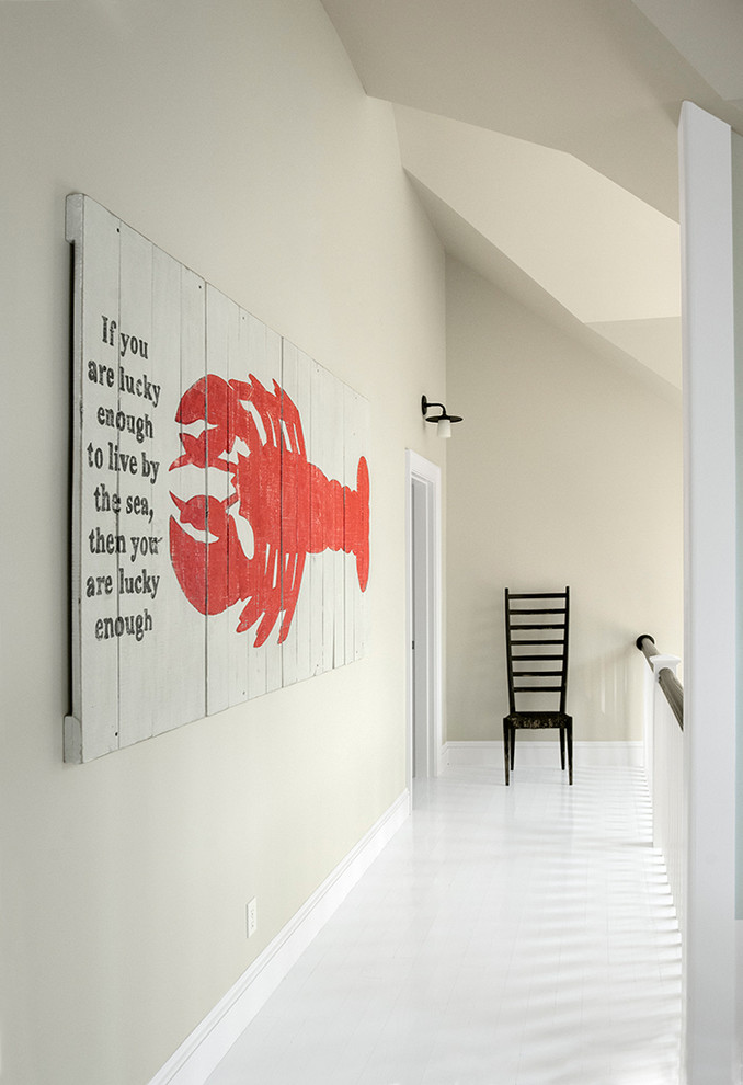 Hallway - coastal hallway idea in Portland Maine with beige walls