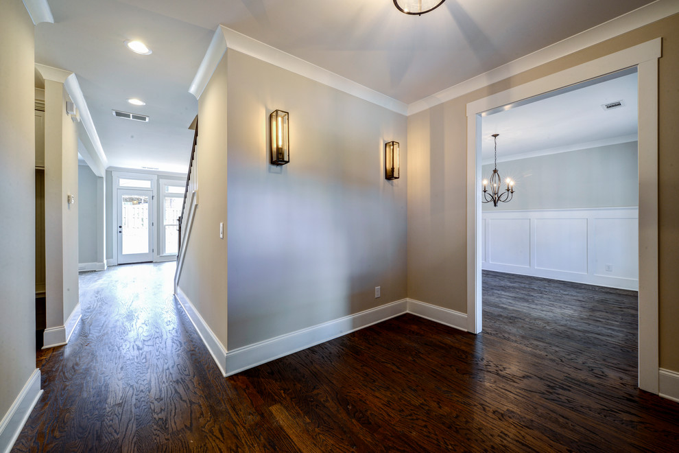 Example of a mid-sized arts and crafts dark wood floor hallway design in Atlanta with gray walls