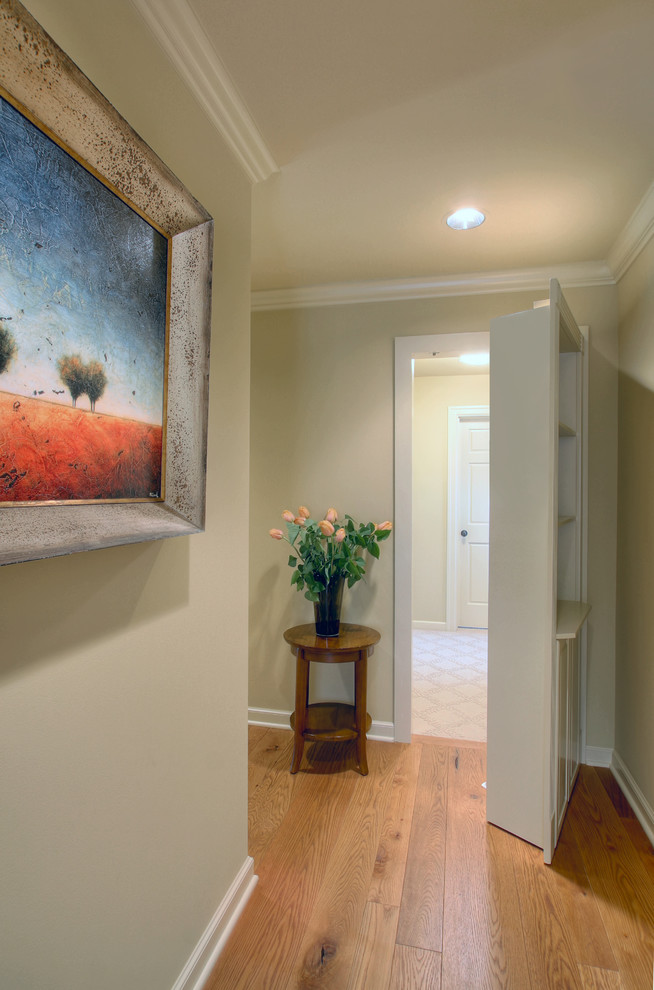 Inspiration for a timeless medium tone wood floor hallway remodel in Seattle with gray walls