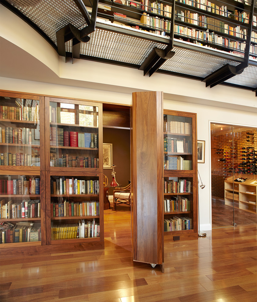 Inspiration for a huge contemporary medium tone wood floor and brown floor hallway remodel in New York with beige walls
