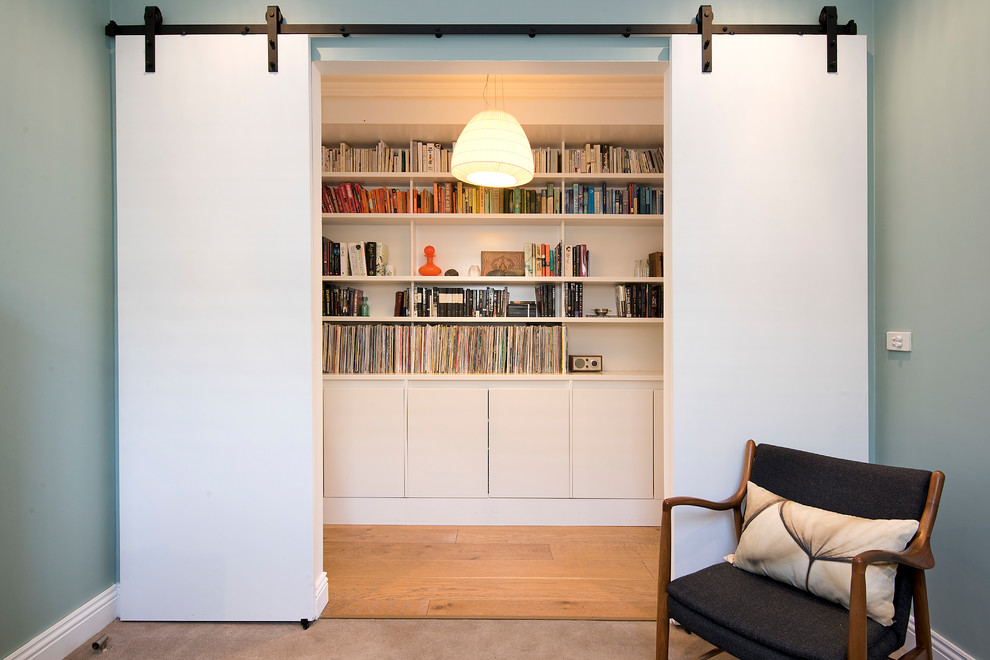 Hallway - contemporary medium tone wood floor and brown floor hallway idea in Sydney with blue walls