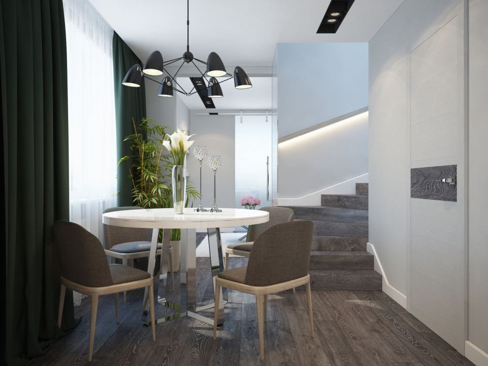 Idée de décoration pour une grande salle à manger minimaliste avec un mur blanc, sol en stratifié, un sol marron, un plafond à caissons et du lambris.