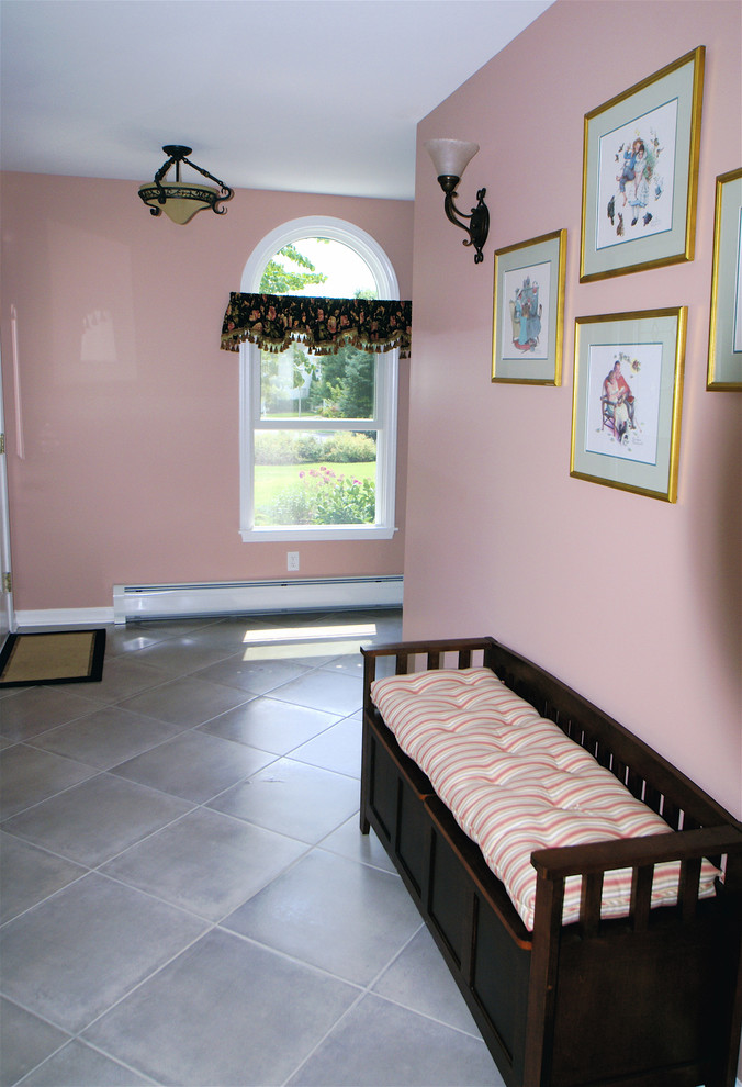 Hallway - small traditional ceramic tile hallway idea in New York with pink walls