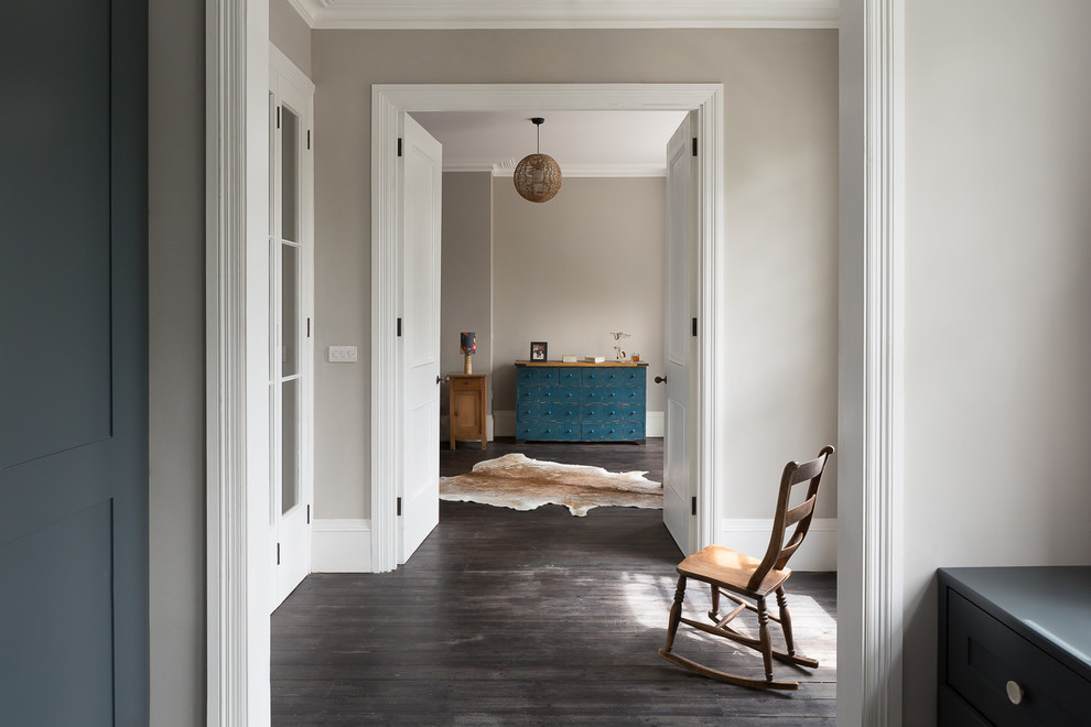 Hallway - transitional hallway idea in London with gray walls